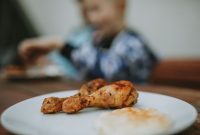 aap-quick-air-fryer-dinner-recipes-for-two-1790861168 Appetizing grilled chicken drumsticks served on a white plate, perfect for lunch.