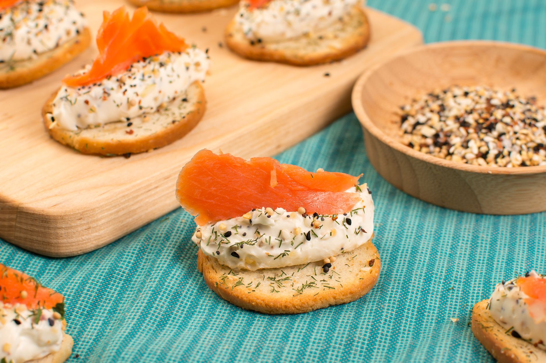 Delicious salmon and cream cheese appetizers on crackers, perfect for any occasion.